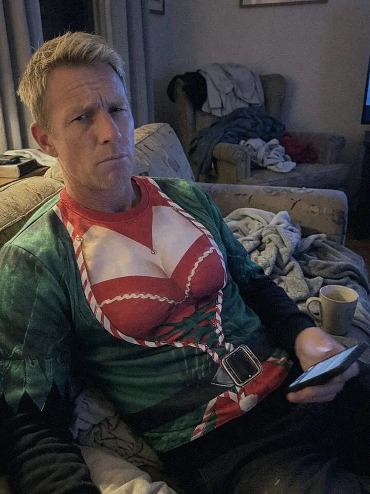 No. 6 Elf Esteem slumped on a sofa at night, looking annoyed.